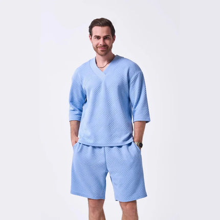 The 2025 new men's summer suit is a casual and versatile solid-color jacquard V-neck short-sleeved T-shirt with two shorts