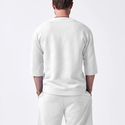 The 2025 new men's summer suit is a casual and versatile solid-color jacquard V-neck short-sleeved T-shirt with two shorts