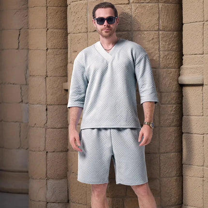 The 2025 new men's summer suit is a casual and versatile solid-color jacquard V-neck short-sleeved T-shirt with two shorts