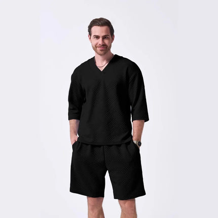 The 2025 new men's summer suit is a casual and versatile solid-color jacquard V-neck short-sleeved T-shirt with two shorts